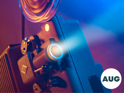 A vintage old fashioned film projector in a dark room